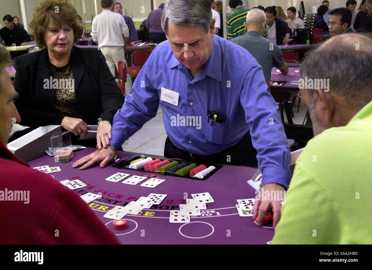 Thunder Valley Casino Dealer School Instructor Barbie Clark holds hand of student Joseph Varga, 61, in proper position during training sessions Friday February 14, 2003 , in Rocklin.  Sacramento Bee /  Owen Brewer/ZUMA Press Stock Photo