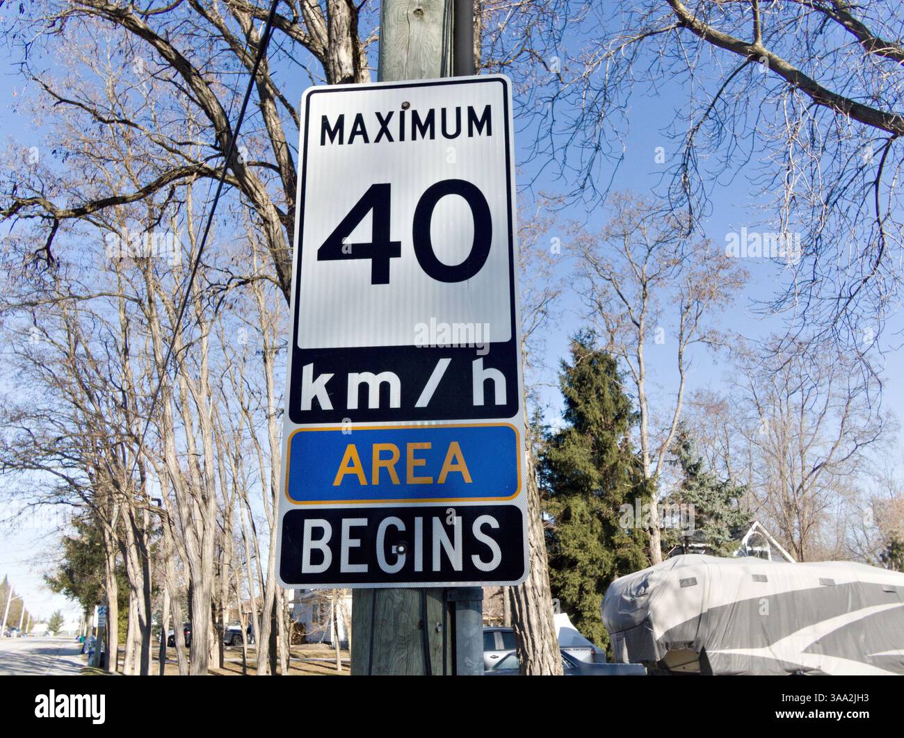 Clearly visible area begins sign alerts drivers to slow down entering a ...