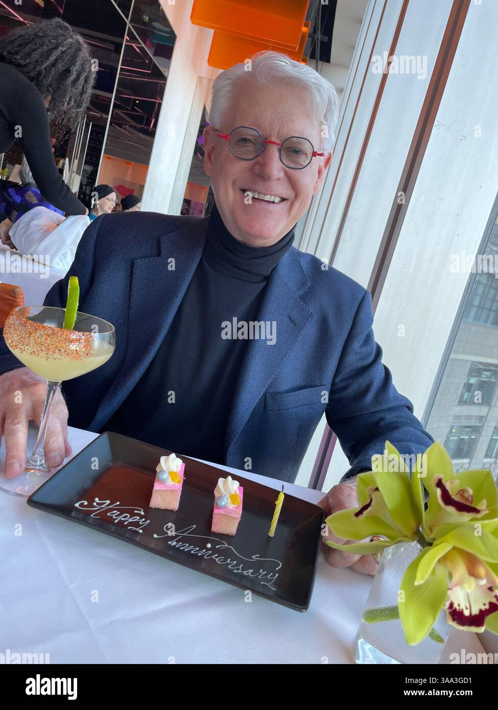 Happy pensioner enjoying a special occasion at the Ark restaurant, Robert located in Columbus Circle, 2025, New York City, USA - Smartphone Captured Stock Image