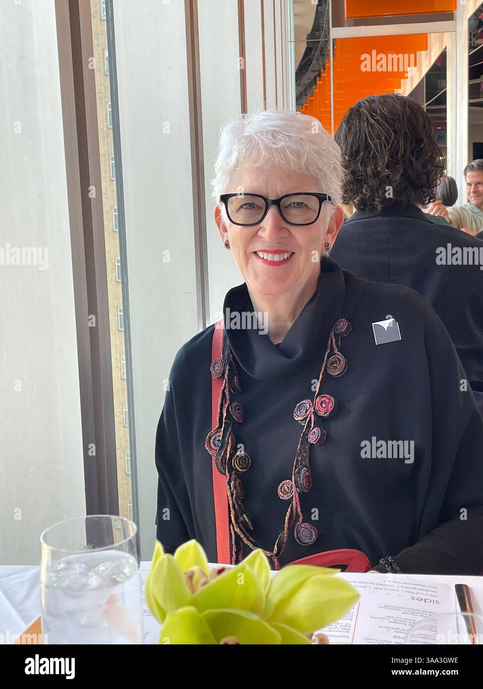 Happy pensioner enjoying a special occasion at the Ark restaurant, Robert located in Columbus Circle, 2025, New York City, USA - Smartphone Captured Stock Image