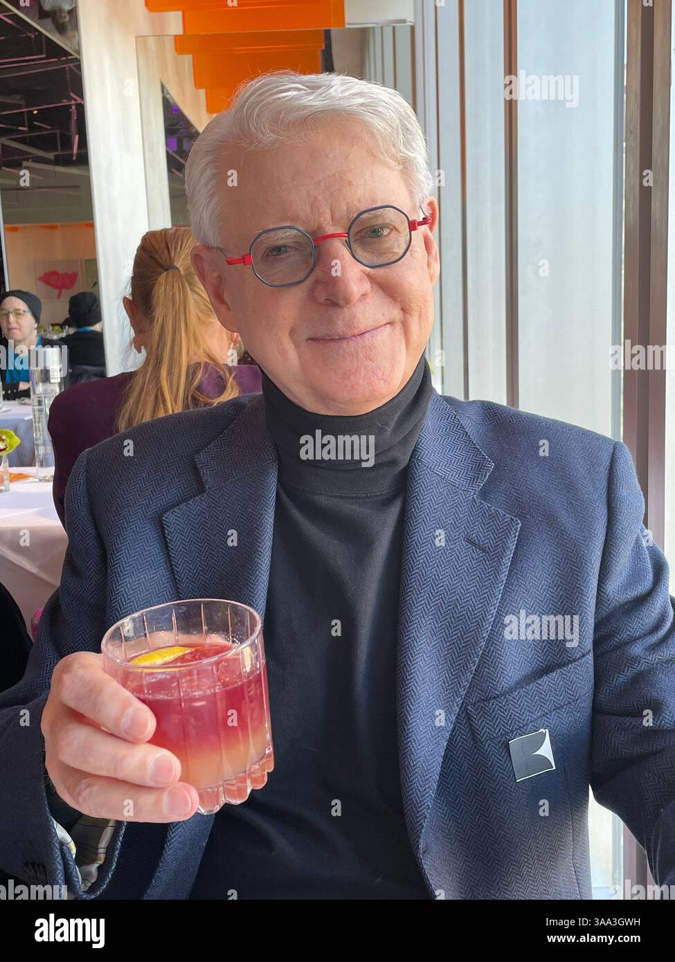 Happy pensioner enjoying a special occasion at the Ark restaurant, Robert located in Columbus Circle, 2025, New York City, USA - Smartphone Captured Stock Image