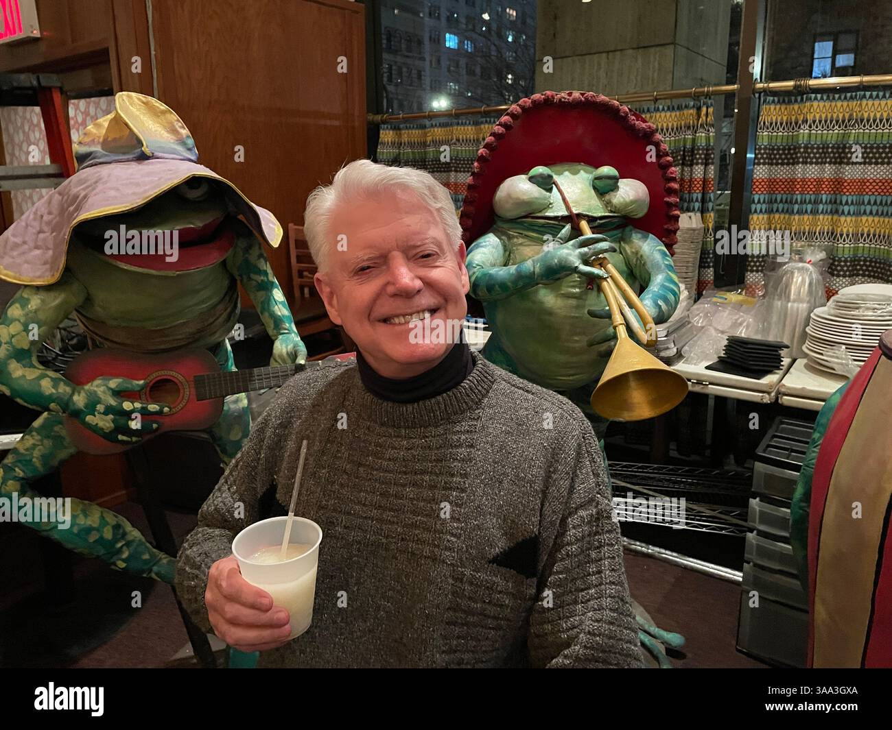 Loyal senior customer enjoys a final margarita at the closing of El Rio Grande Tex-Mex restaurant, January 2025, New York City, USA - Smartphone Captured Stock Image