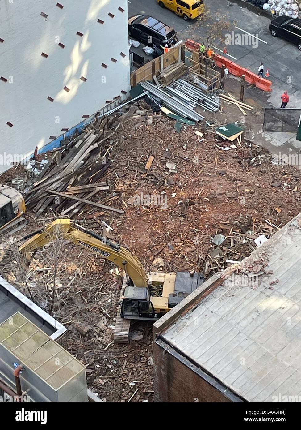 Blue collar laborers demolishing brownstone buildings in Murray Hill Historic District, 2025, New York City, USA - Smartphone Captured Stock Image