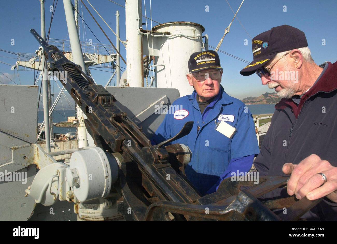 Dec 18, 2002; Richmond, CA, USA;Rolly Hauck, Restoration Manager and Tom Bottomley plan to restore a couple of the 20 mm machine guns on the Red Oak Victory ship docked at Ferry Point, in Richmond California.  They said the guns would sound real but would not shoot anything.  Wednesday, December 18, 2002. Stock Photo