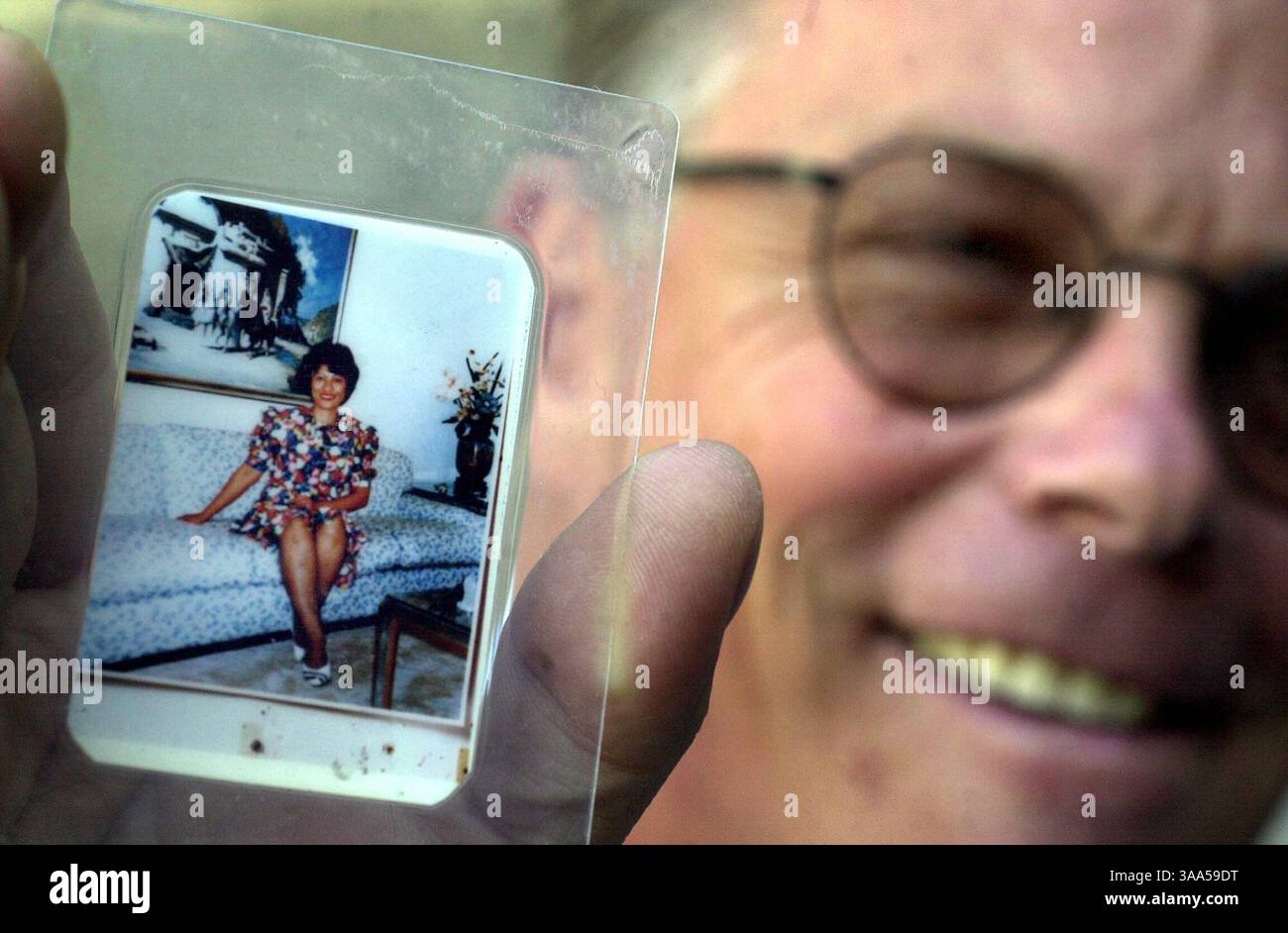 Lyale Shellman (cq), 51, holds up a photograph of his wife, Mercedita ...