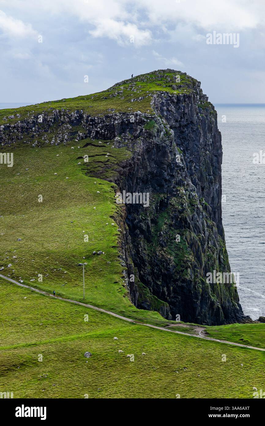 Dramatic Point Neist Point at sunset is a breathtaking sight—its lighthouse stands ...