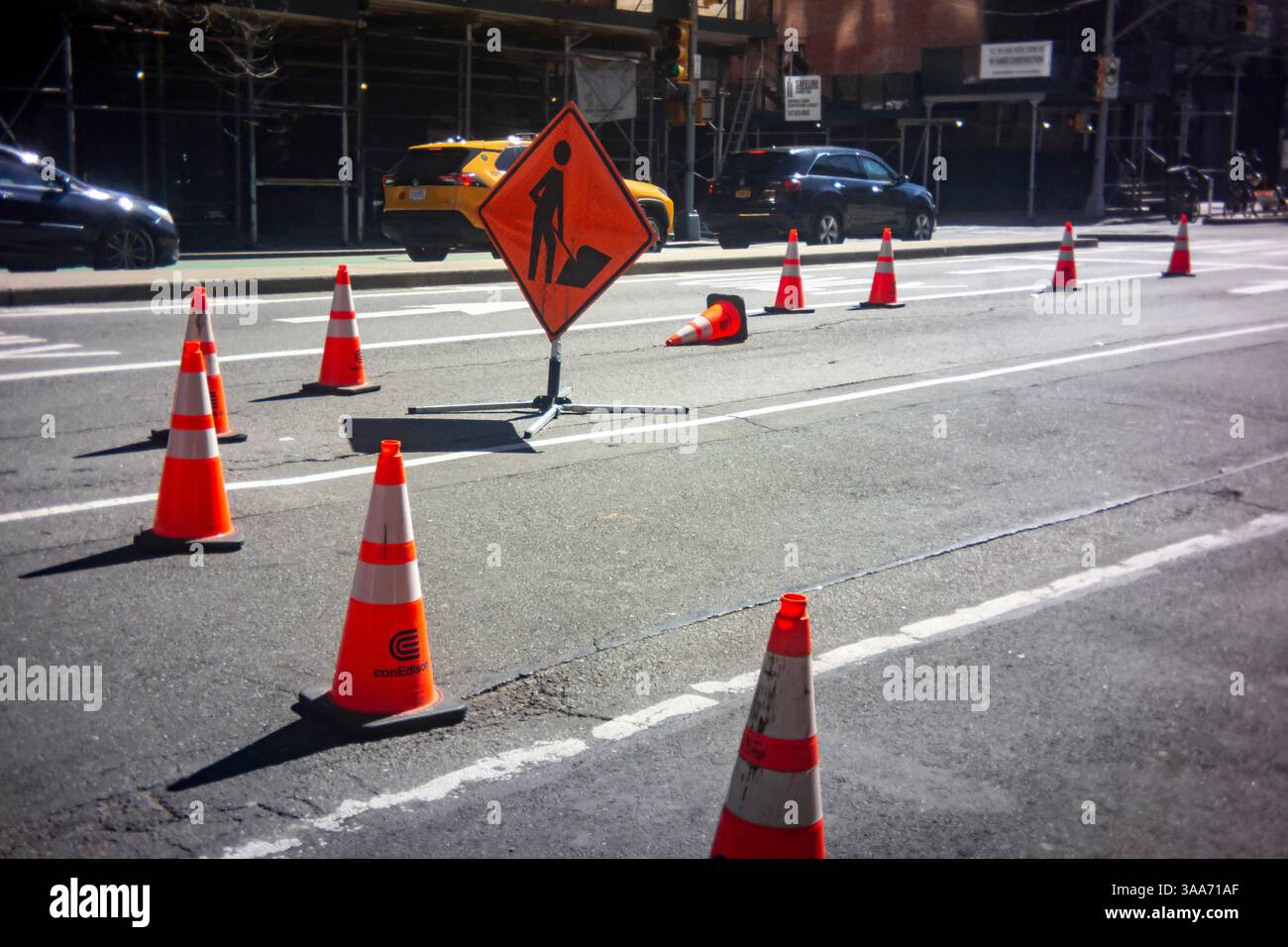 Traffic cones on the pavement to protect workers in the New York neighborhood of Chelsea on Tuesday, March 18, 2025.  (© Richard B. Levine) Stock Photo