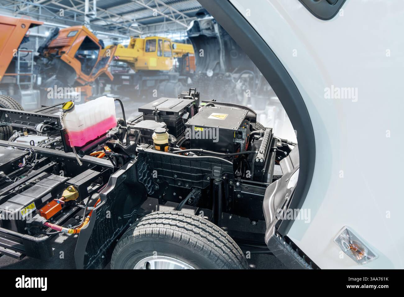 Electric truck in car service. Electric vehicles maintenance. Stock Photo