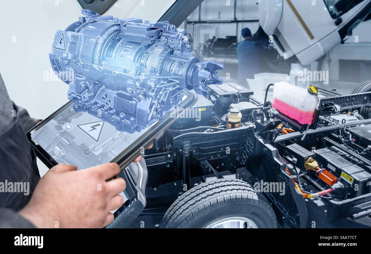 Serviceman with digital tablet repair electric truck using augmented reality.. Electric vehicles maintenance.. Stock Photo