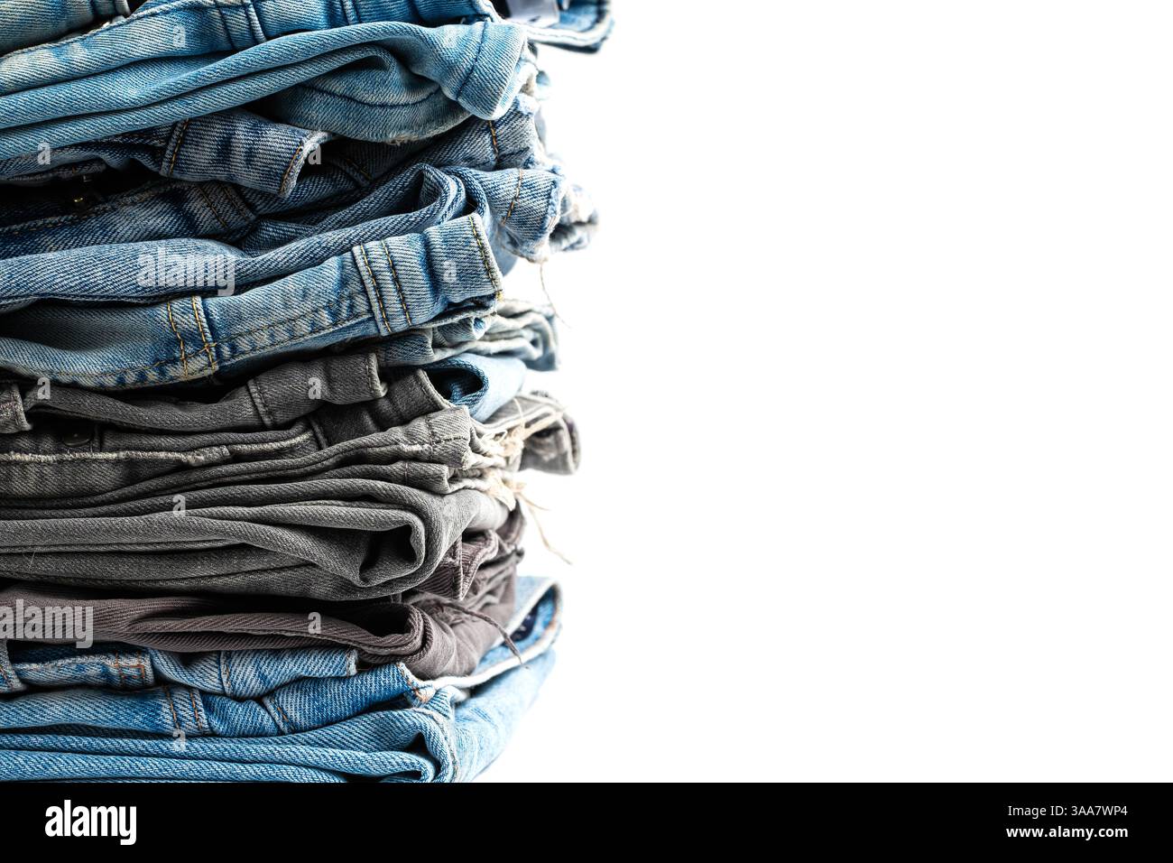 Stack of jeans isolated on white background Stock Photo