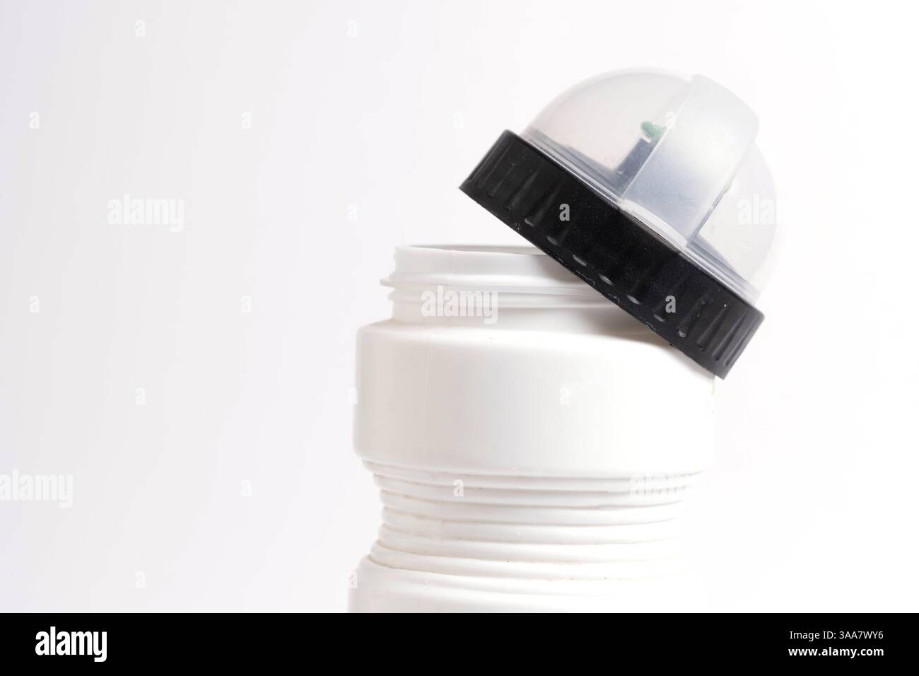 Plastic bottle with an open lid on white background. Isolate Stock Photo