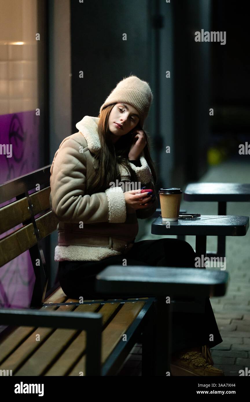 Woman using smartphone in dimly hi-res stock photography and images - Alamy