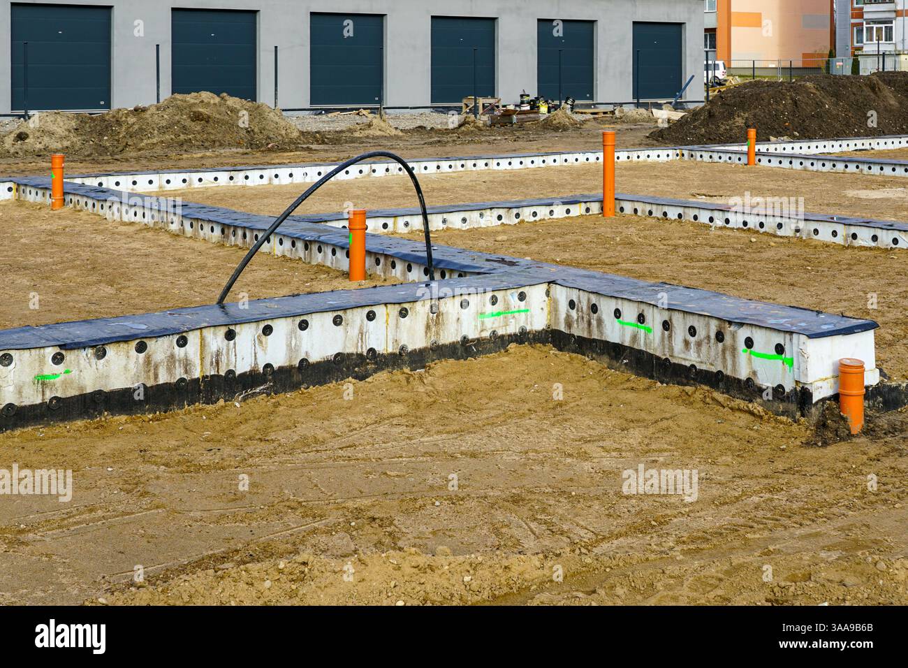 Row house construction site with prepared concrete foundations and ...