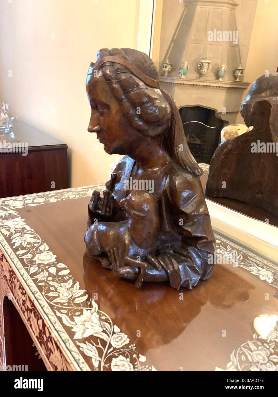 Anglesey Abbey Cambridgeshire UK England hall dog lights stand pictures carpets carpet decorations library Mary Queen of Scots Henry the eighth - Smartphone Captured Stock Image