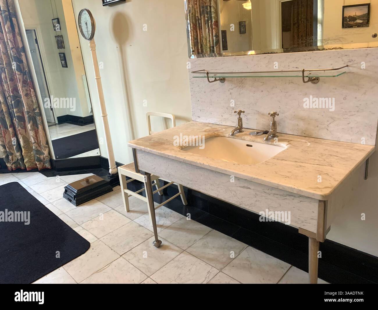 Anglesey Abbey Cambridgeshire UK England hall bathroom stand pictures carpets carpet decorations library Mary Queen of Scots Henry the eighth - Smartphone Captured Stock Image