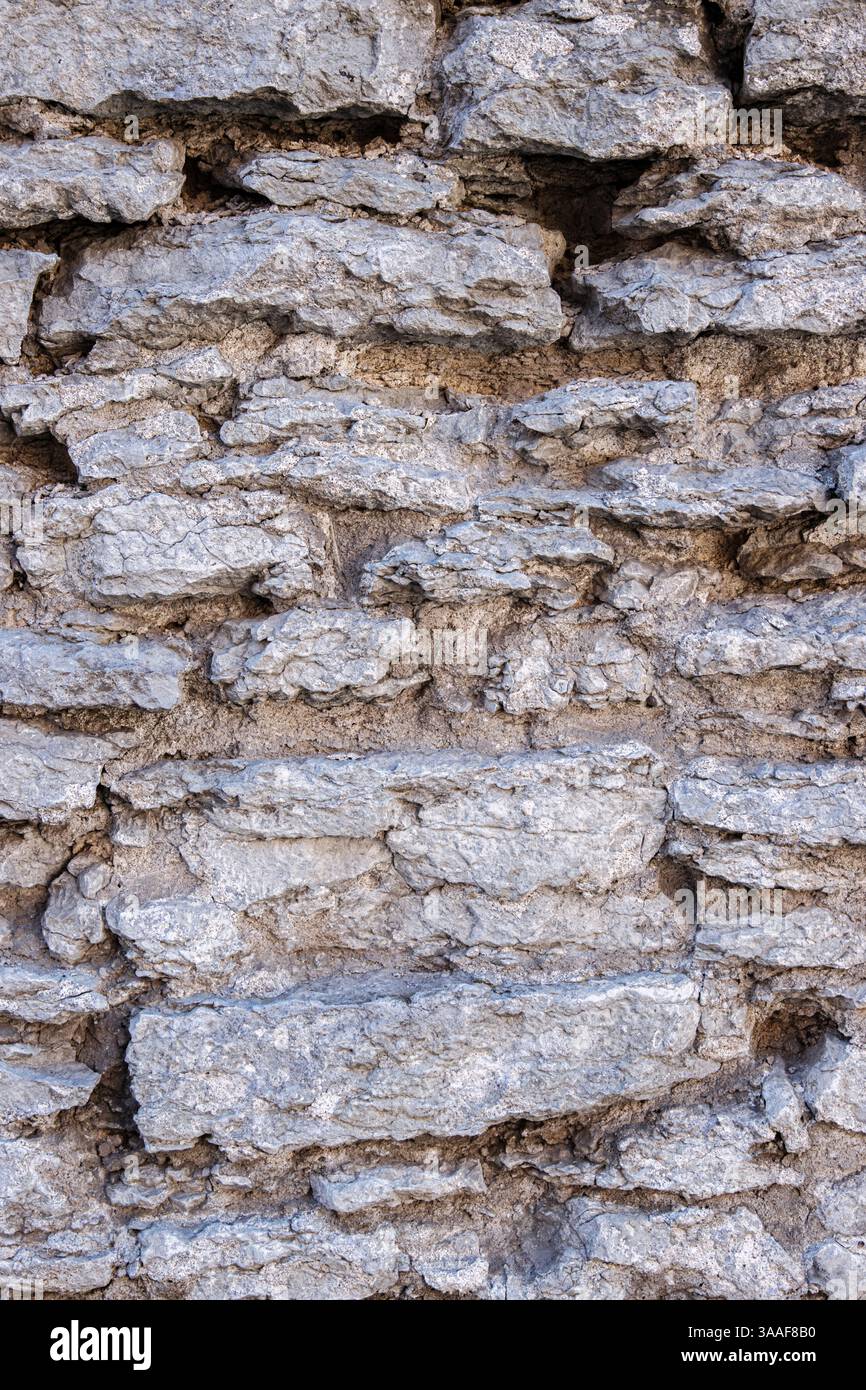 Architectural Rocks Texture Weathered rough aged gray stone wall texture with rugged, coarse uneven ...