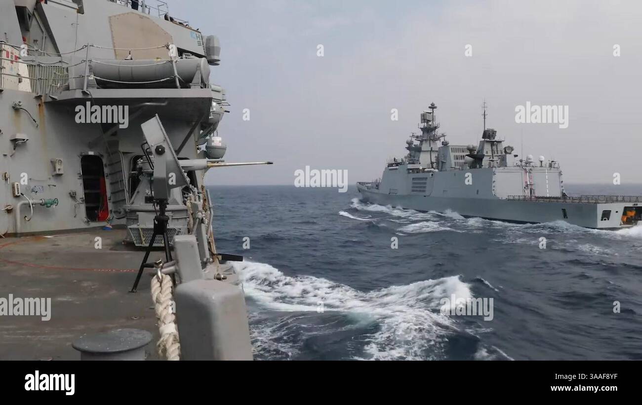 INS Shivalik as seen from USS John S. McCain during MALABAR 2020 Phase I, seems to have been equipped with the ATLAS ELEKTRONIK ACTAS towed array sonar. Also not the torpedo tube doors.. Stock Photo