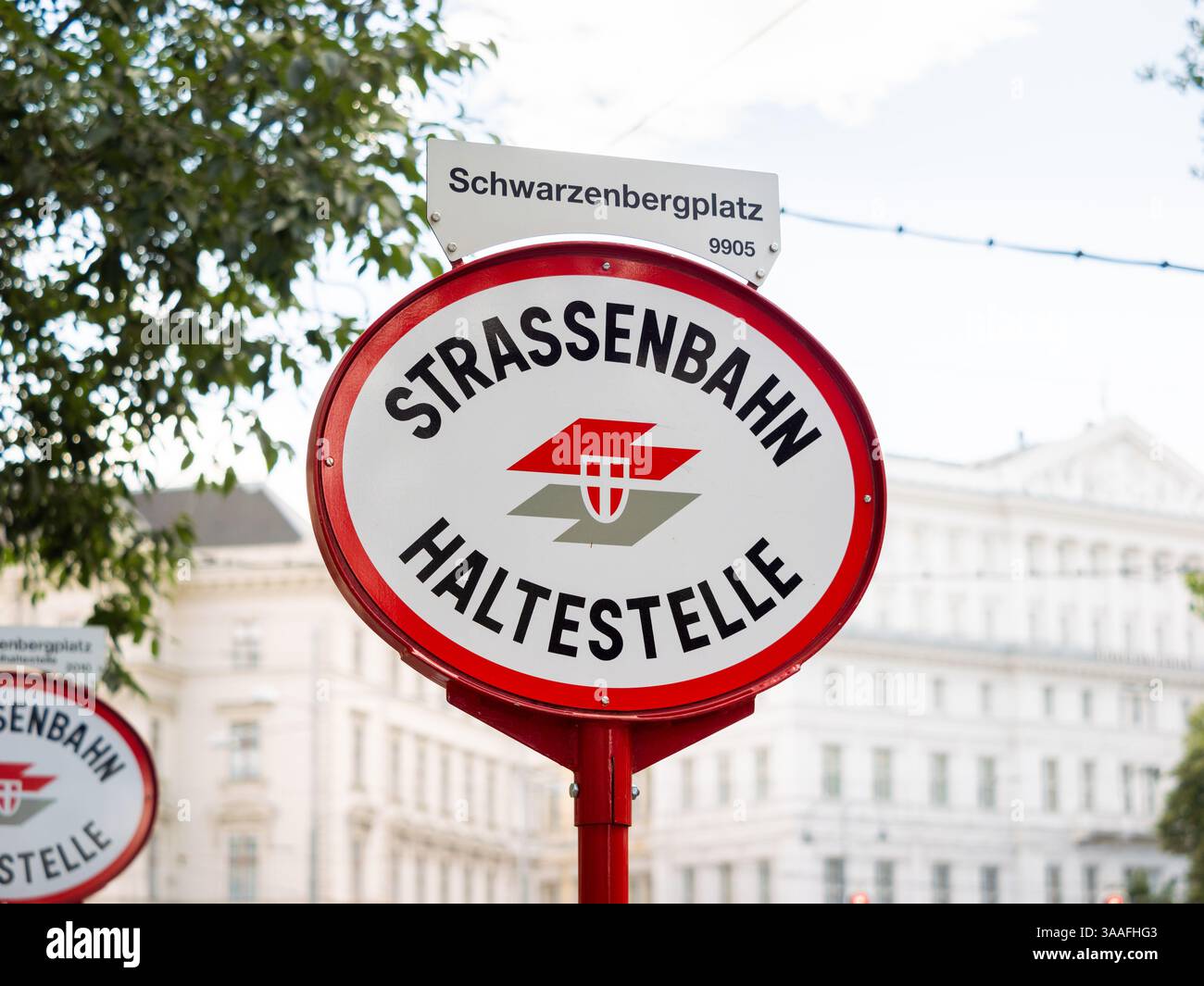 Strassenbahn Haltestelle (tram stop) sign at the Schwarzenbergplatz, Vienna. Close-up of the Austrian location signage of the public transportation. Stock Photo