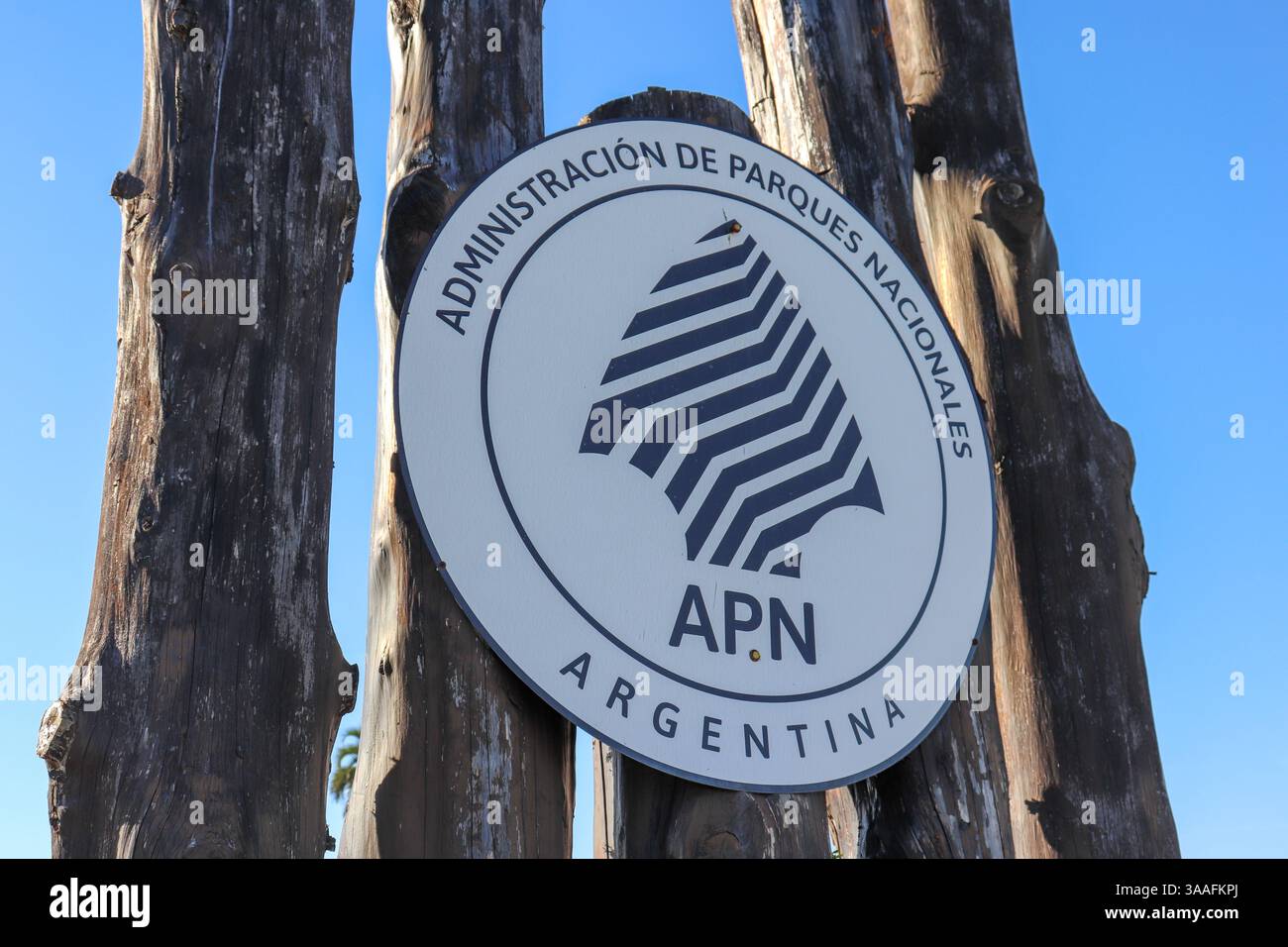 Gateway to El Palmar National Park with sign 'PARQUE NACIONAL EL PALMAR' in dark letters on a snowy background. Stock Photo
