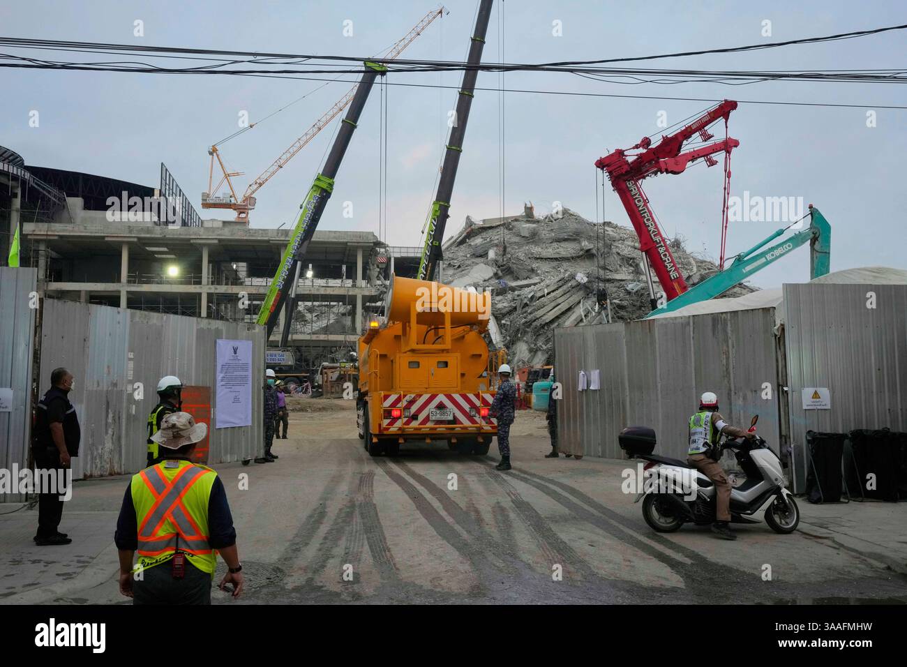 Collapted Machine Dust settler machine enters the site of an under-construction high-rise ...