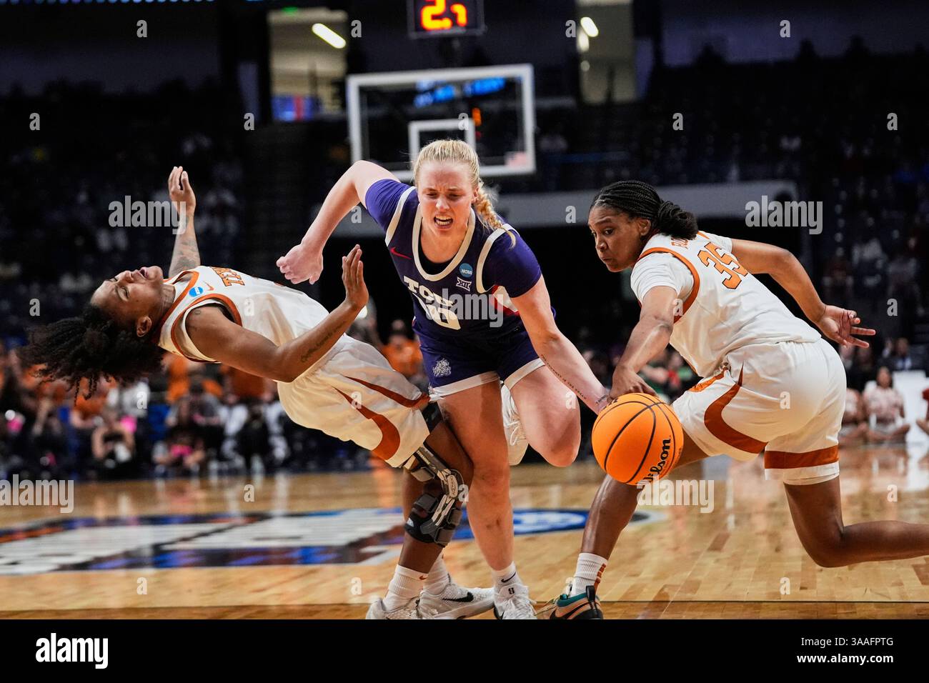 Hailey Guard TCU guard Hailey Van Lith (10) drives to the basket between Texas guard ...
