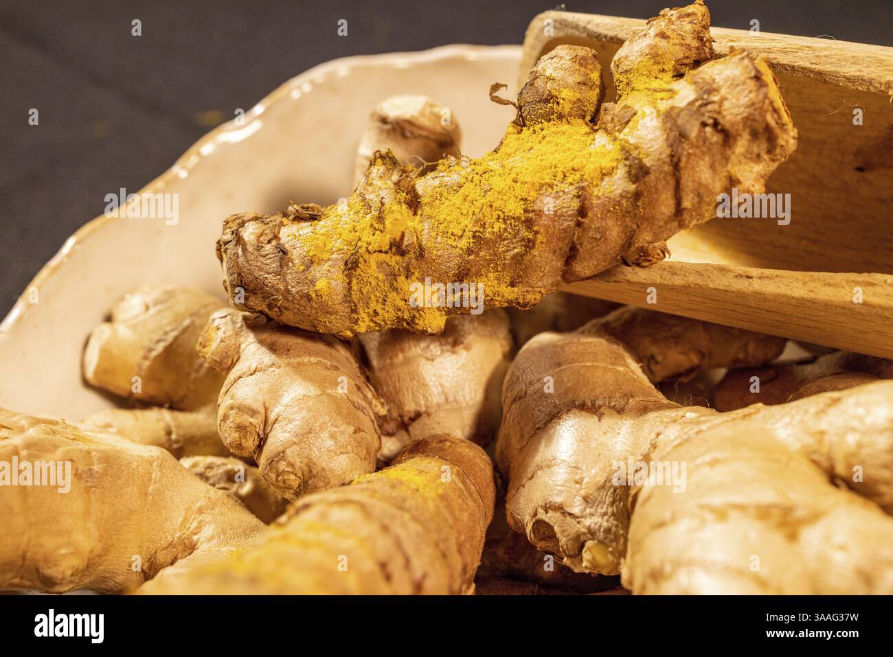 Ginger and Turmeric Roots on a dark background Stock Photo