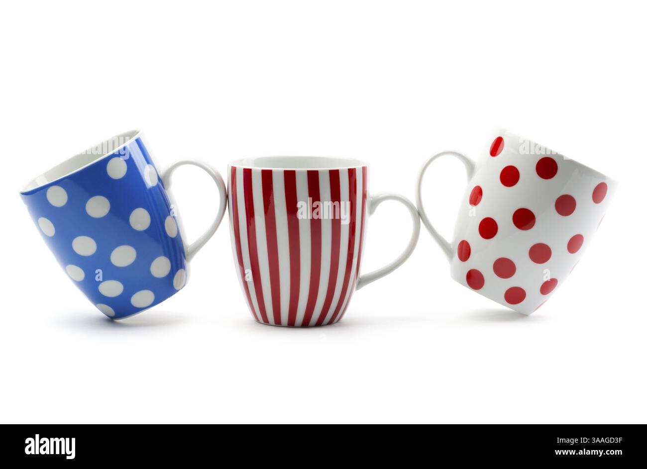 Three porcelain cup with stripes and dots. Isolate on white Stock Photo
