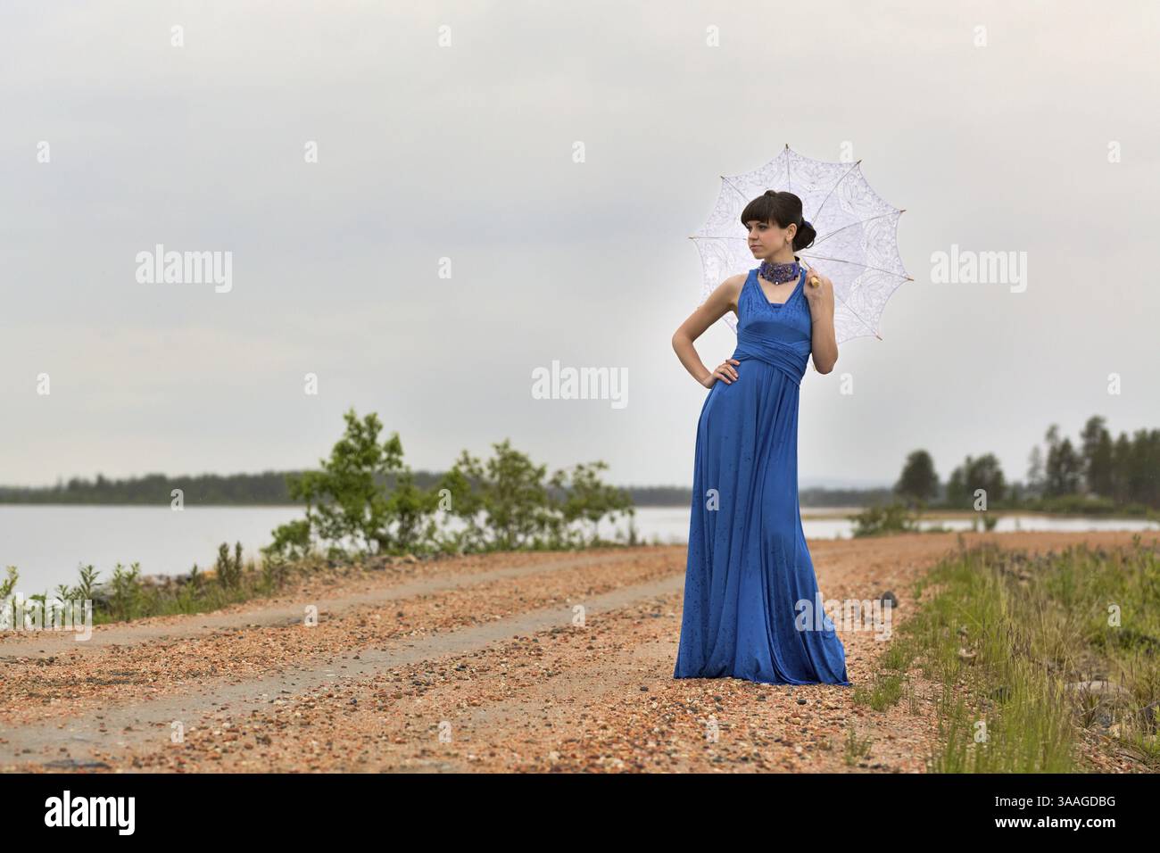 Beautiful dark haired model strolling through the woods. Fairy Tale setting Stock Photo