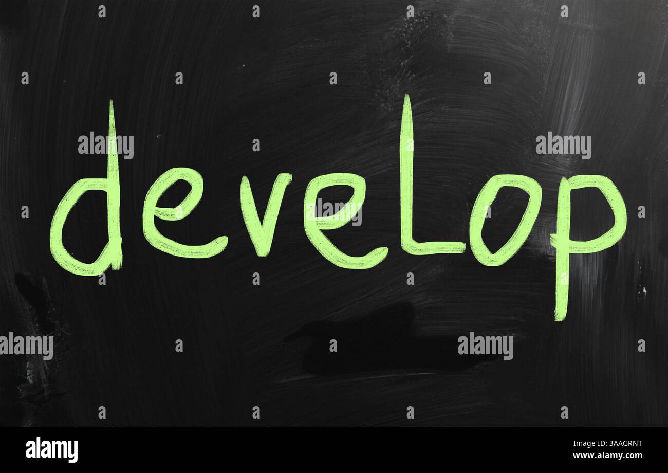 Develop handwritten with white chalk on a blackboard Stock Photo