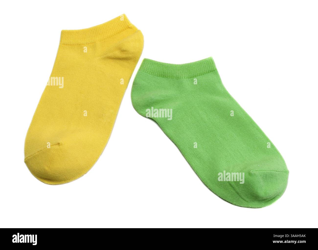 Two colored socks, yellow and green. Isolate on white Stock Photo