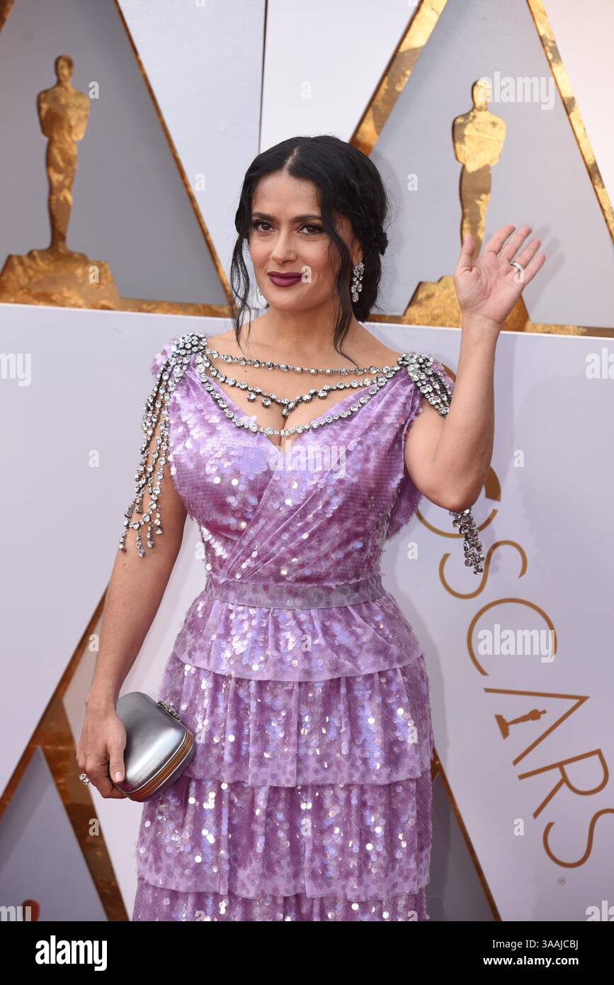 salma hayek purple gucci dress Salma Hayek dazzles in a purple gown as she arrives at glam Gucci show during Paris Fashion Week
