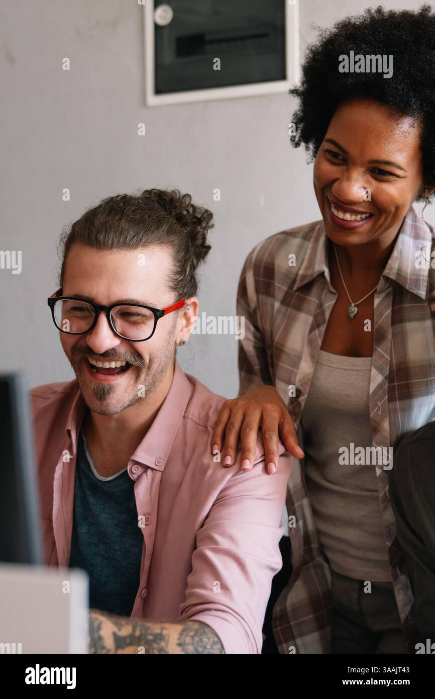 Mixed team of software engineers brainstorming ideas. Diverse app developers collaborating as group Stock Photo