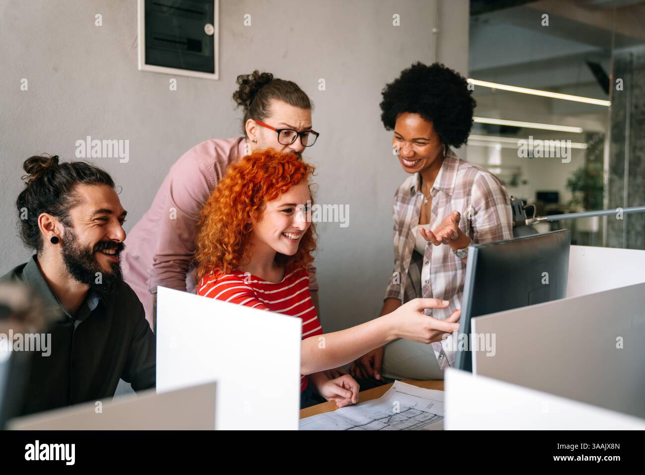 Mixed team of software engineers brainstorming ideas. Diverse app developers collaborating as group Stock Photo