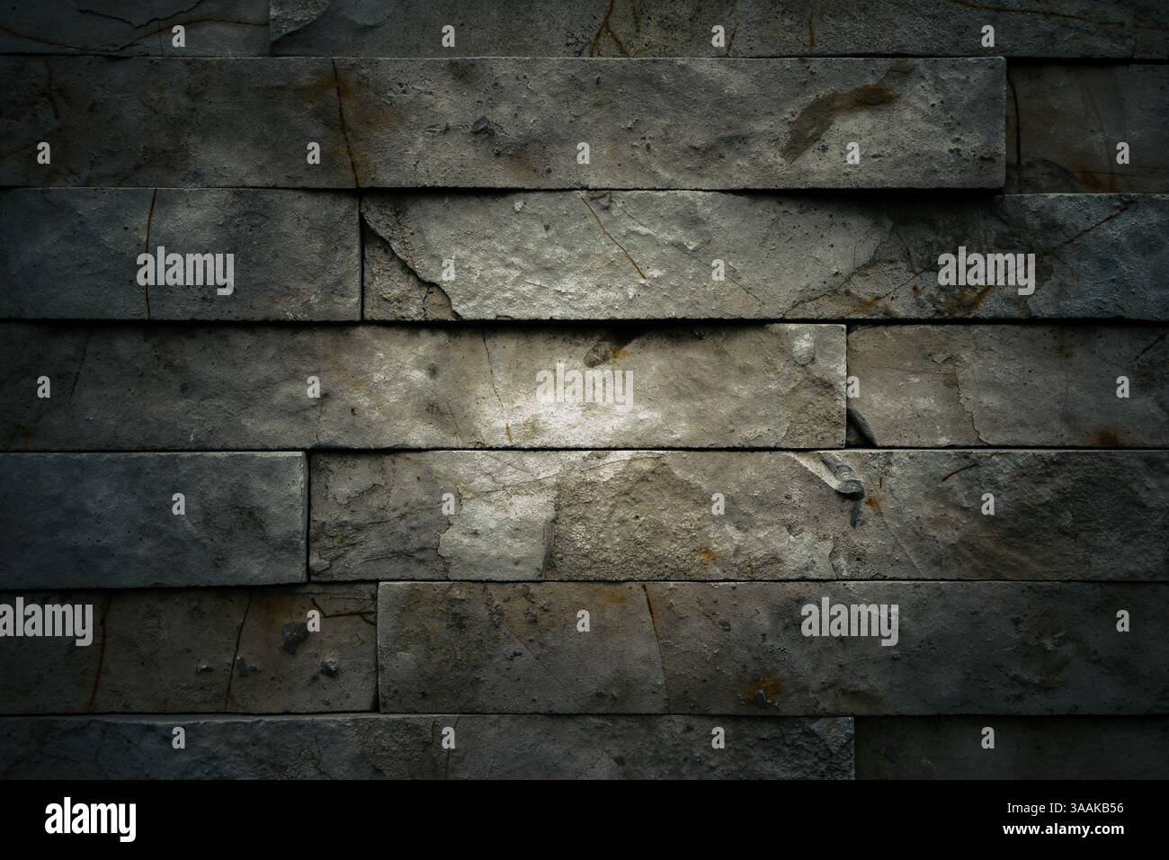 Interesting facade decorative bricks under dramatic lighting. Stock Photo