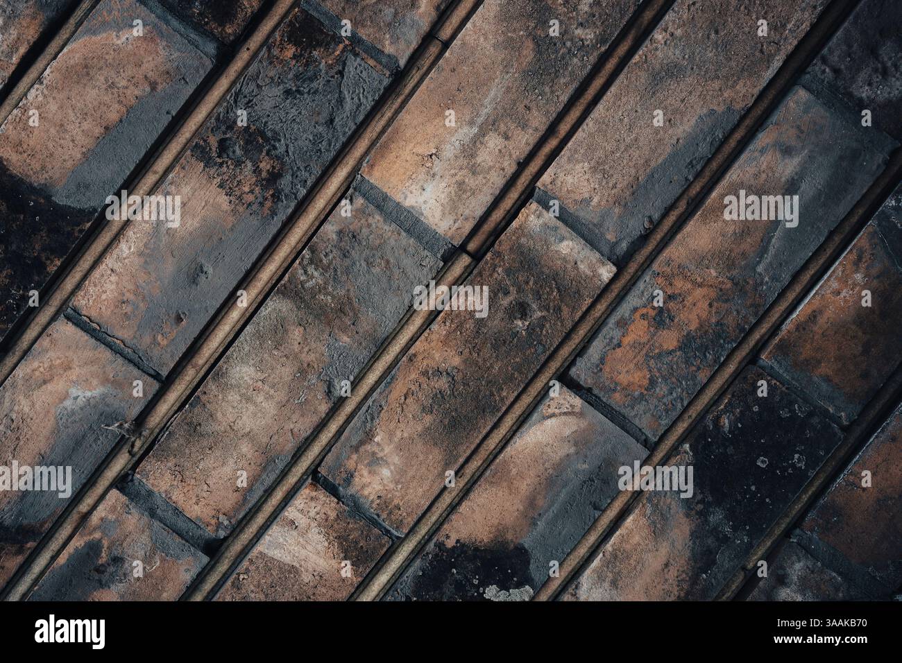 Interesting facade decorative bricks under dramatic lighting. Stock Photo