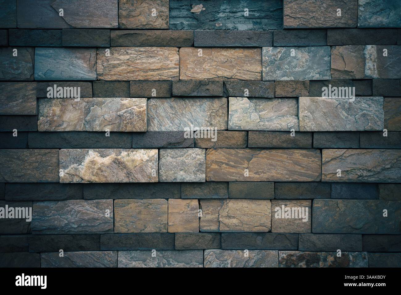 Interesting facade decorative bricks under dramatic lighting. Stock Photo