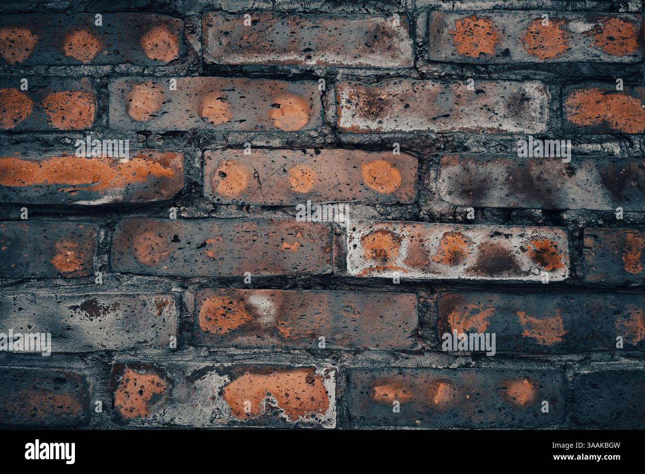 Interesting facade decorative bricks under dramatic lighting. Stock Photo