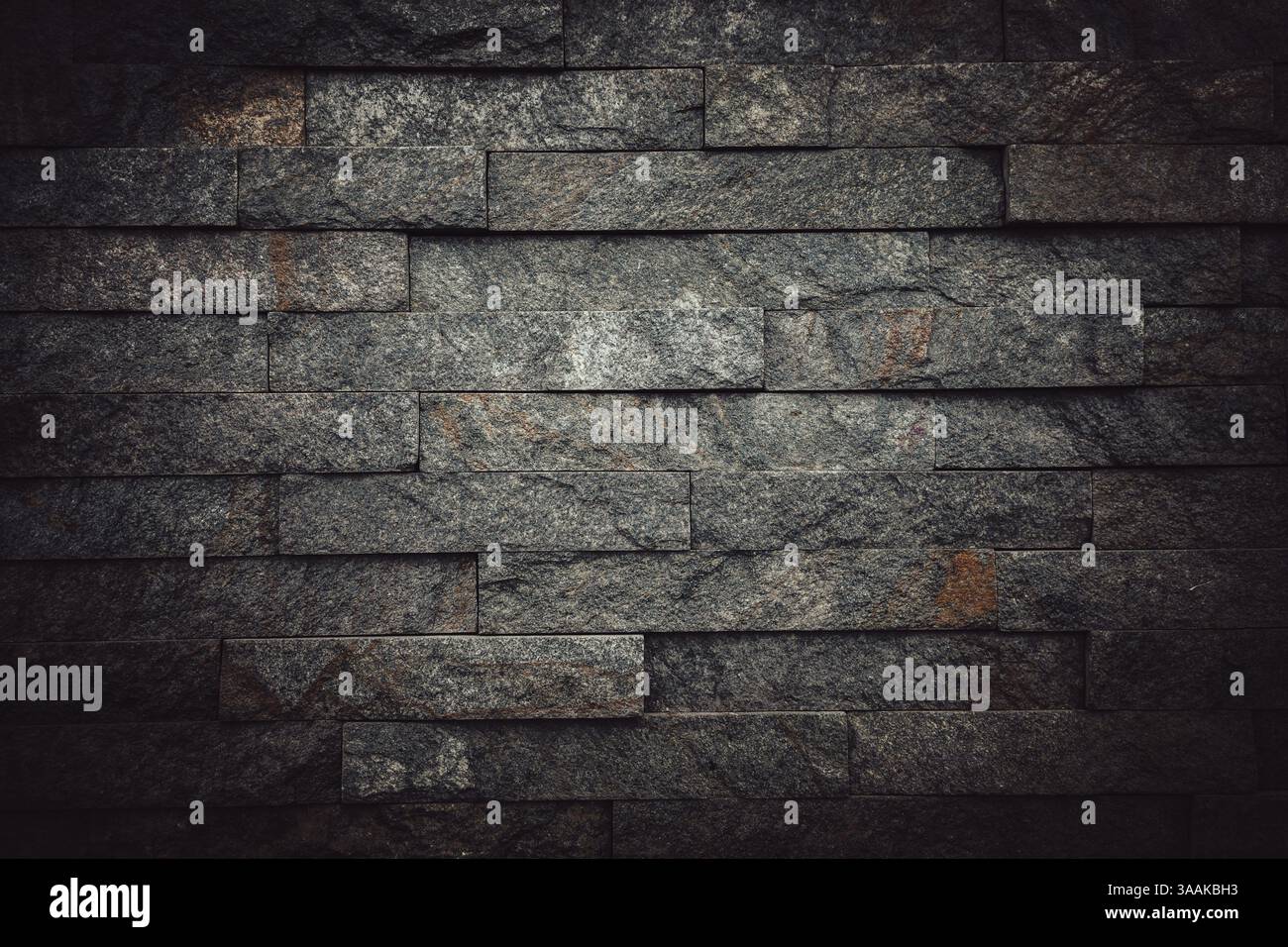 Interesting facade decorative bricks under dramatic lighting. Stock Photo