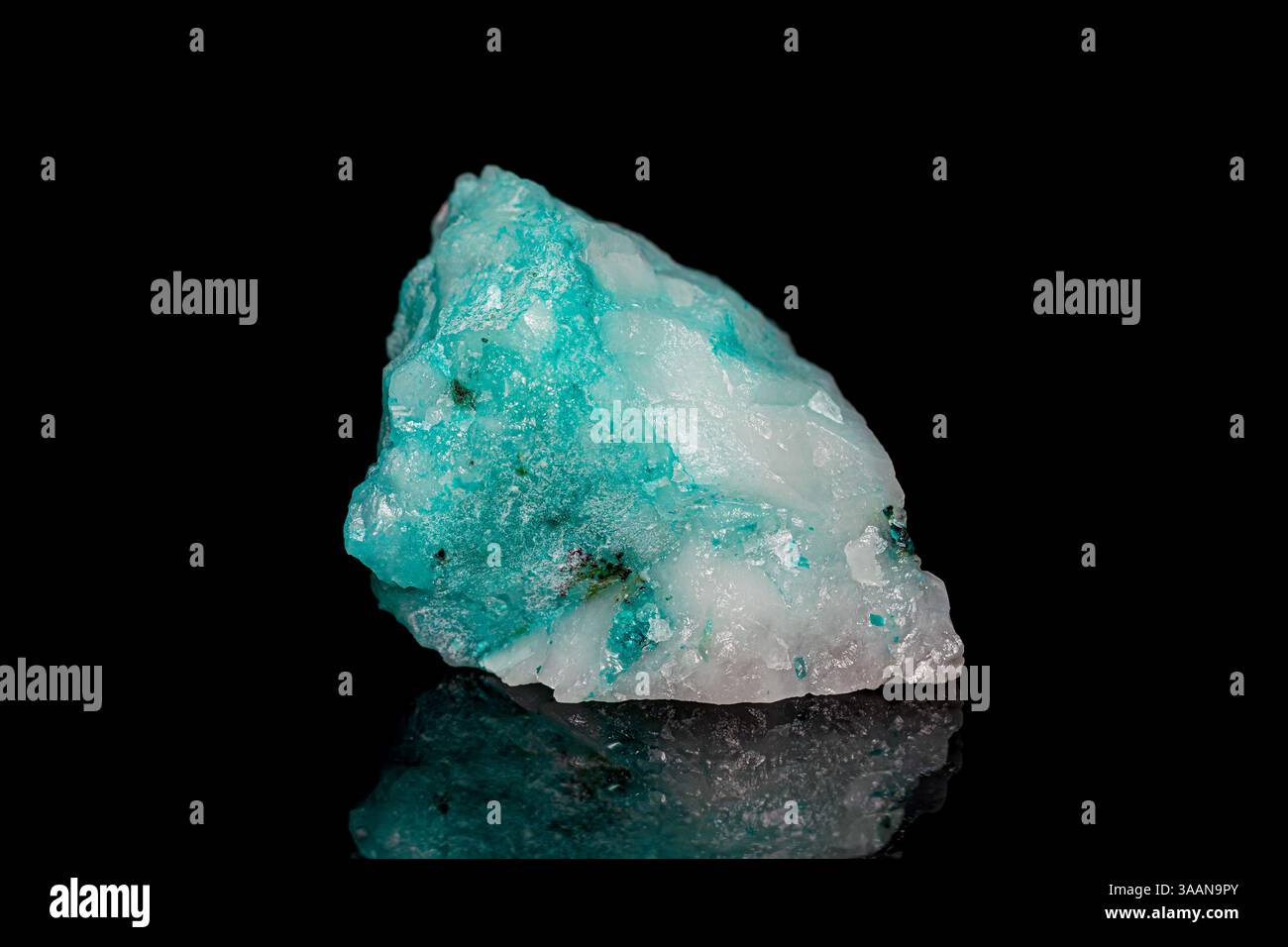 Natural rough blue-green Phoenix stone (Fynchenite, Ajoite) on dark background Stock Photo