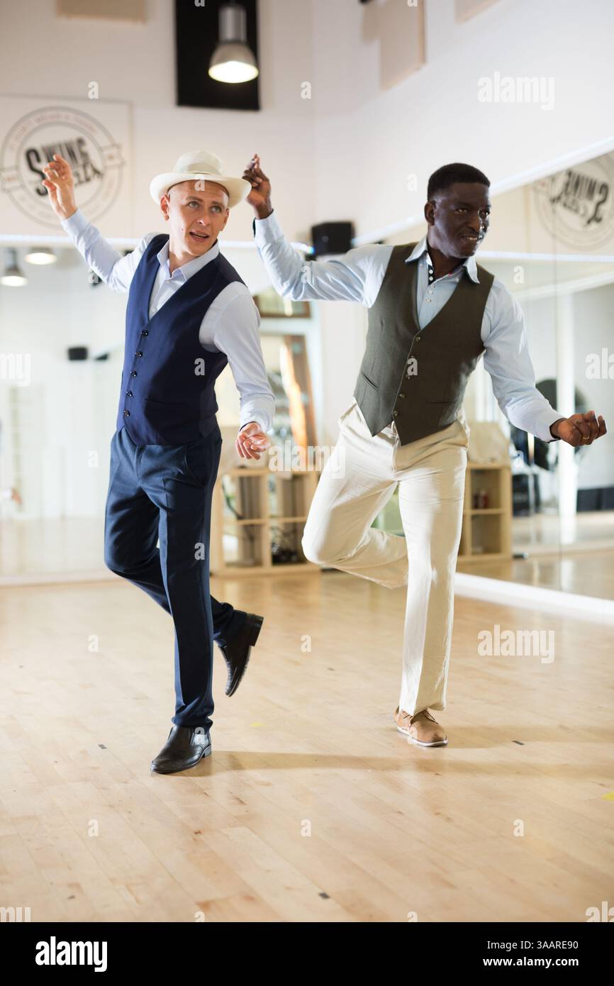 Two professional dancers practicing lindy hop in dance class Stock Photo