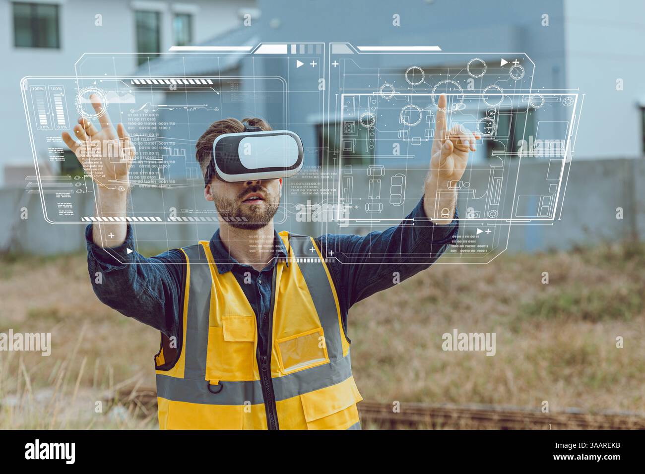 Engineer male worker using Visual reality VR or Augmented reality AR technology in construction industry. Modern digital innovation in engineering con Stock Photo