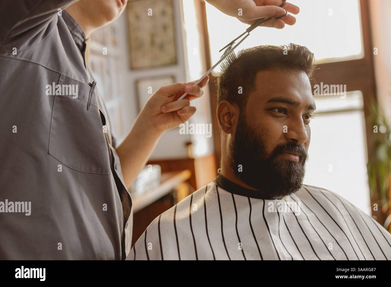 Barber expertly styling clients hi-res stock photography and images - Alamy