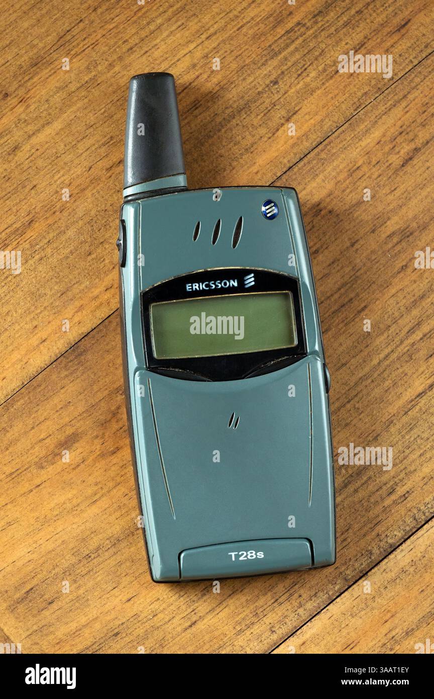 Retro Ericsson T28s cellular phone from the late 1990s placed on a wooden surface Stock Photo