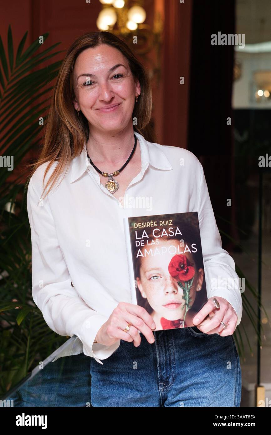 Writer Desiree Ruiz poses during the portrait session during the presentation of her book, *LA CASA DE LAS AMAPOLAS*, in Madrid, April 1, 2025, Spain. Stock Photo
