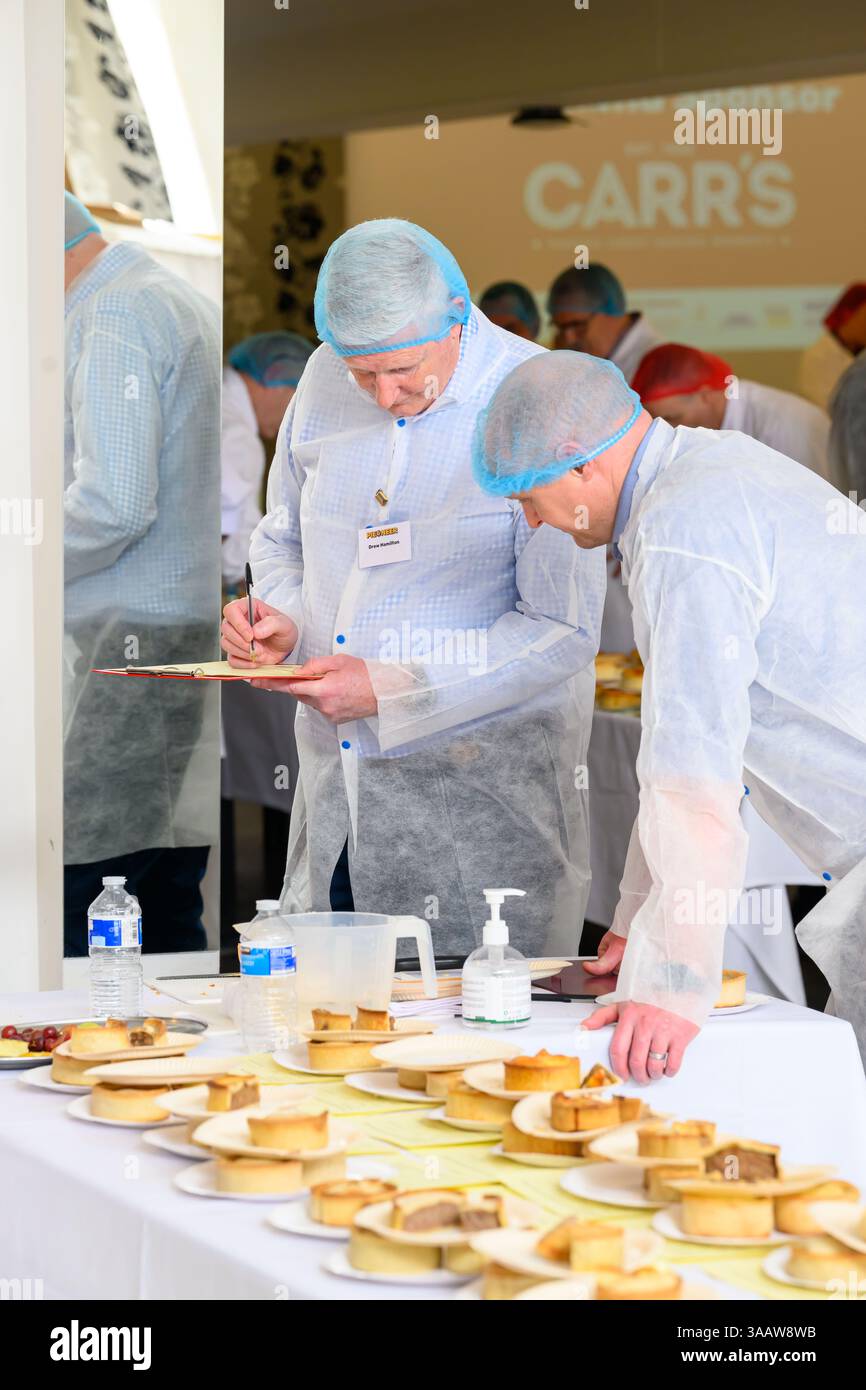 PIEONEERS BATTLE IT OUT FOR RECORD-BREAKING PIE-OFF AT 25TH ANNUAL WORLD CHAMPIONSHIP SCOTCH PIE AWARDS  Over 530 pies compete for crowning glory – bi Stock Photo