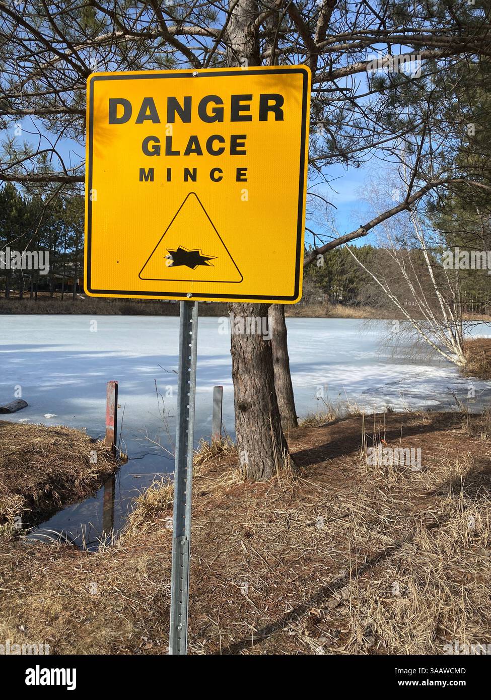Danger thin ice sign in French, Quebec,Canada - Smartphone Captured Stock Image