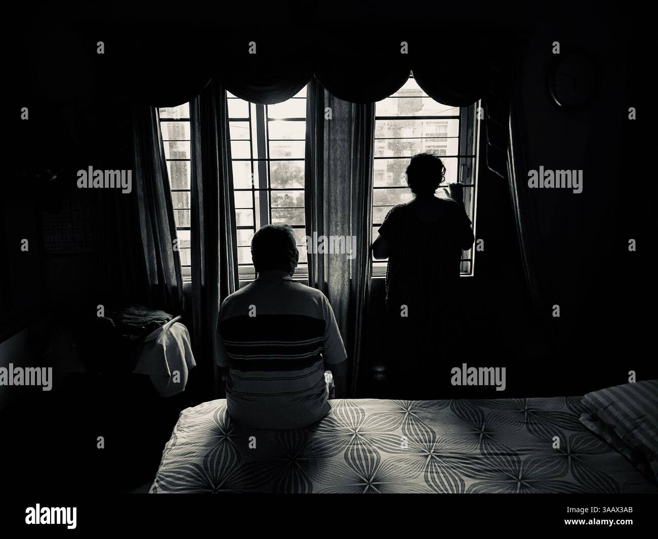 A small family recollecting their journey together - Smartphone Captured Stock Image