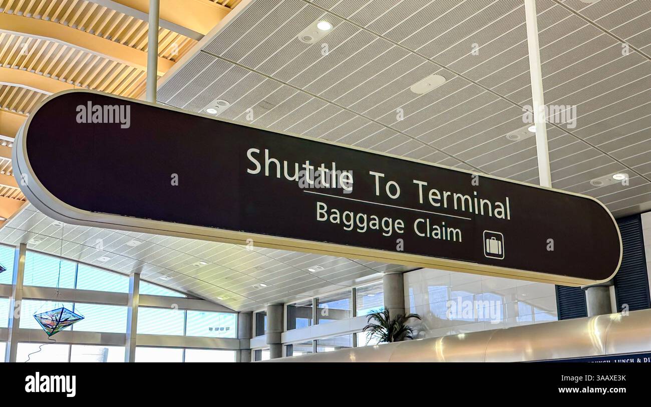Shuttle to terminal and baggage claim sign in an airport - Smartphone Captured Stock Image