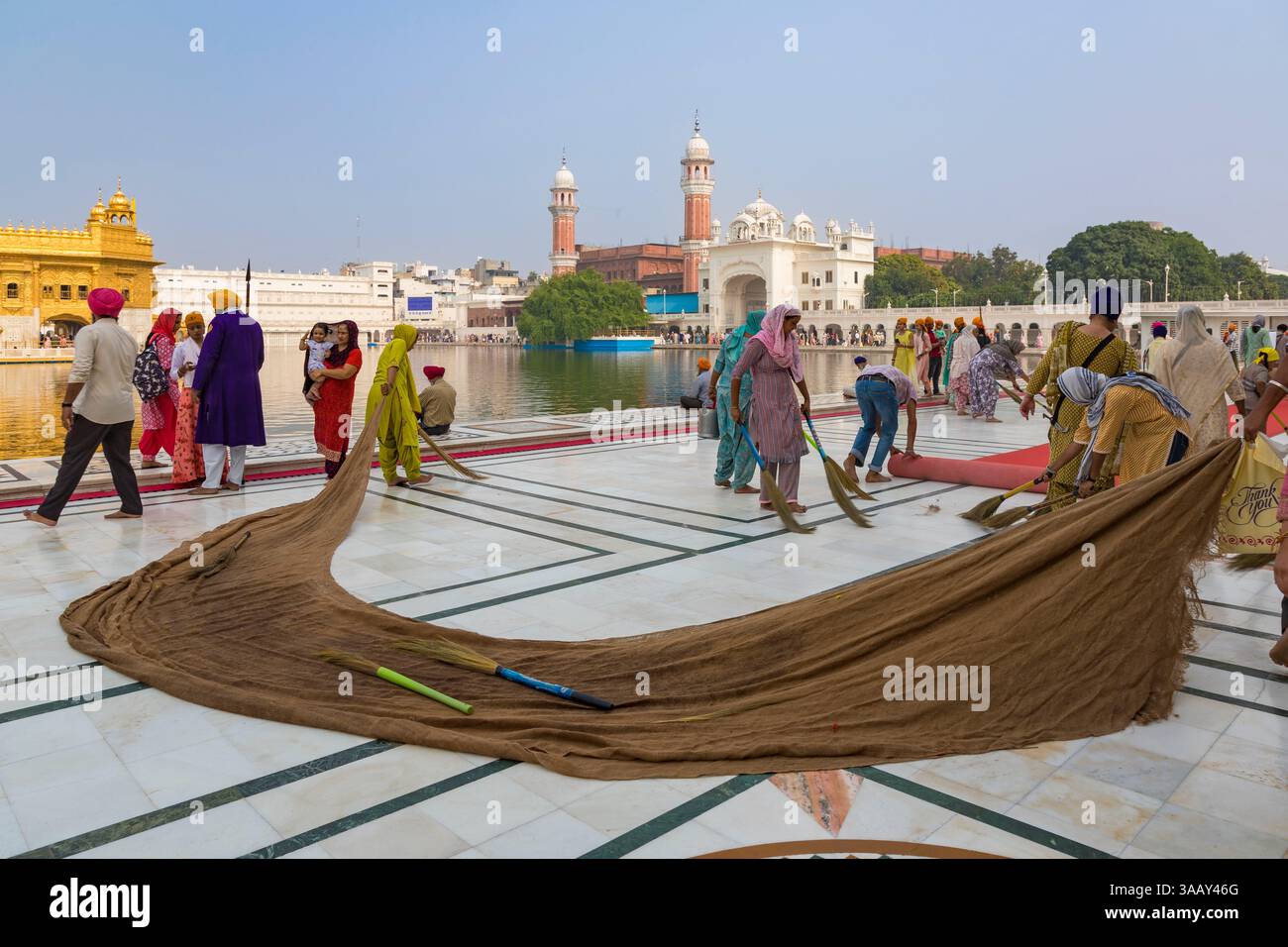 India, Punjab, Amritsar, Golden temple complex, Golden temple (Harmandir Sahib) the holiest building of the Sikhs,cleaning the Parikrama, the white marble path that goes around the temple Stock Photo - Alamy