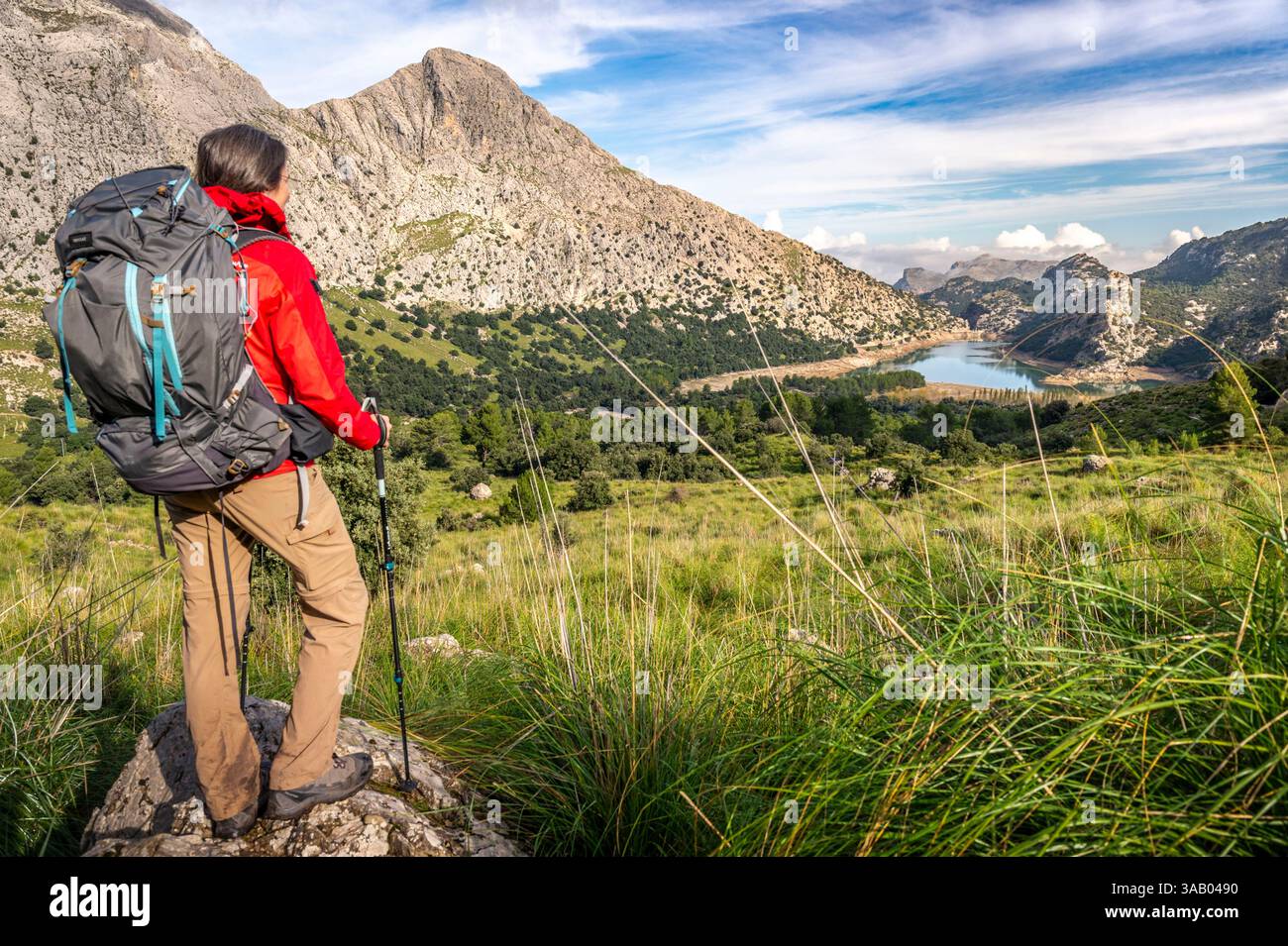 Spain, Balearic Islands, Mallorca, Escorca, Serra de Tramuntana UNESCO World Heritage site, hiker near the Gorg Blau reservoir Stock Photo
